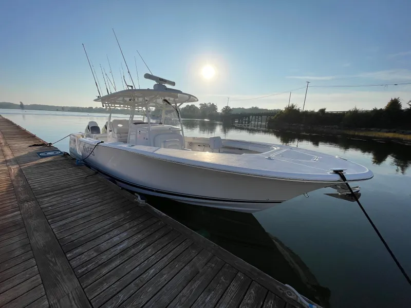 Slide: The Image of 2018 Southport 33 FE boat docked at sunrise. - 3