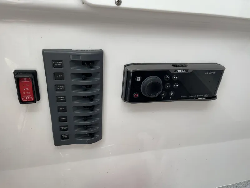 Slide: The Image of Control panel and Fusion stereo system on a 2018 Southport 33 FE boat. - 37