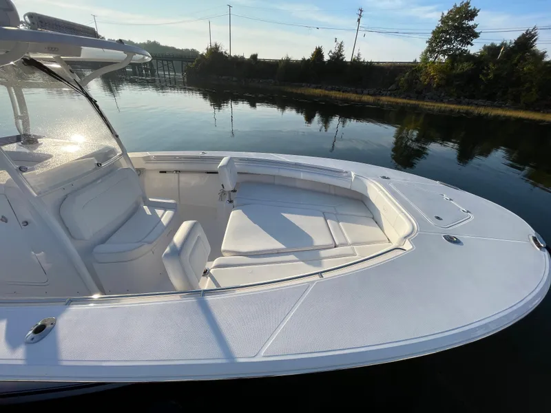 Slide: The Image of 2018 Southport 33 FE boat with spacious seating on calm water. - 4