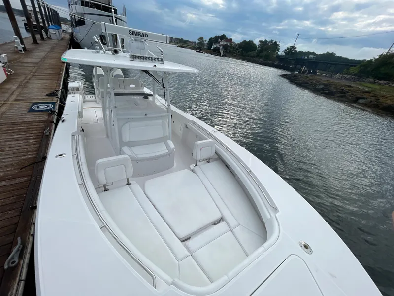 Slide: The Image of 2018 Southport 33 FE boat docked by the water. - 41