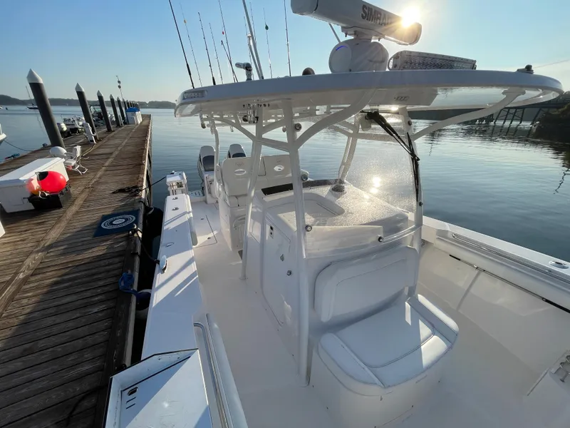 Slide: The Image of 2018 Southport 33 FE boat docked at a marina on a sunny day. - 42