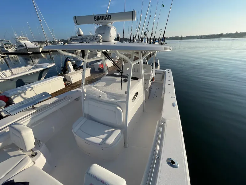 Slide: The Image of 2018 Southport 33 FE boat docked at marina, equipped with Simrad electronics. - 43