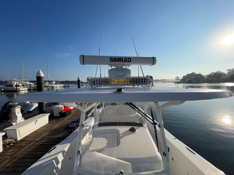 Slide: The Image of 2018 Southport 33 FE boat docked at a marina on a sunny day. - 45