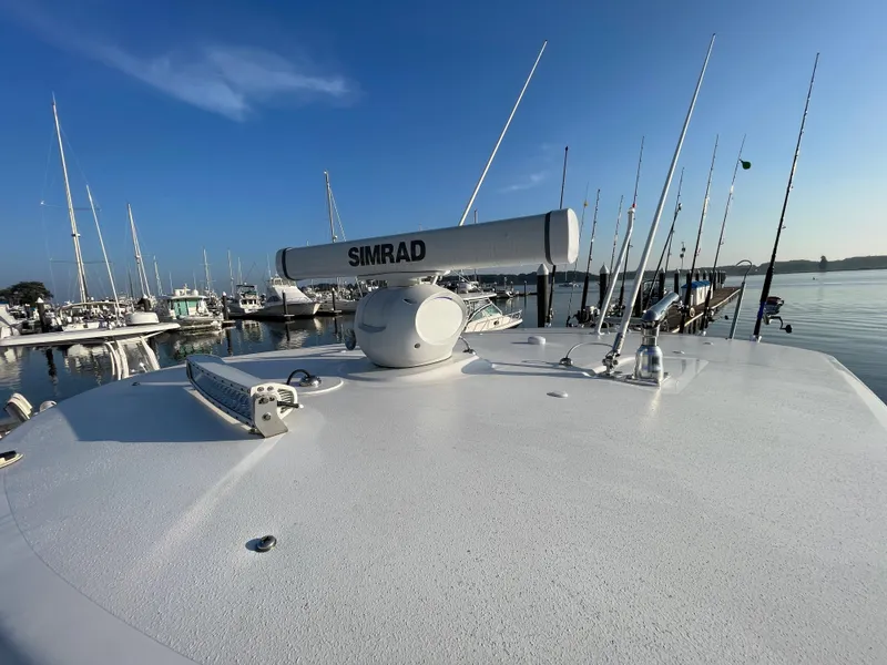 Slide: The Image of 2018 Southport 33 FE boat with Simrad radar at marina. - 48