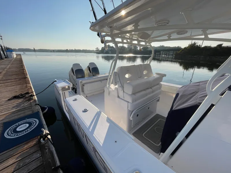 Slide: The Image of 2018 Southport 33 FE boat docked by a calm lake. - 6
