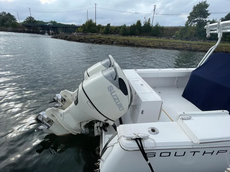 Slide: The Image of 2018 Southport 33 FE boat with Suzuki outboard motors on the water. - 8