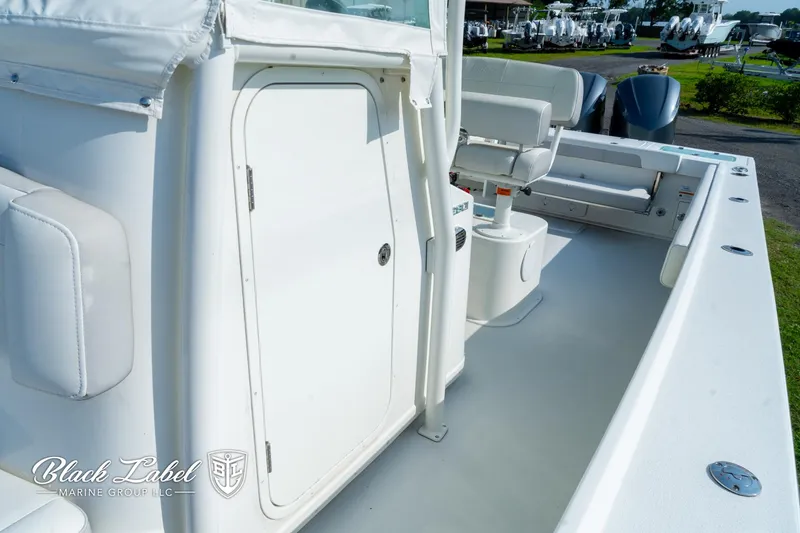 Slide: The Image of 2020 Parker 2801cc boat deck with seating and storage compartment. - 11