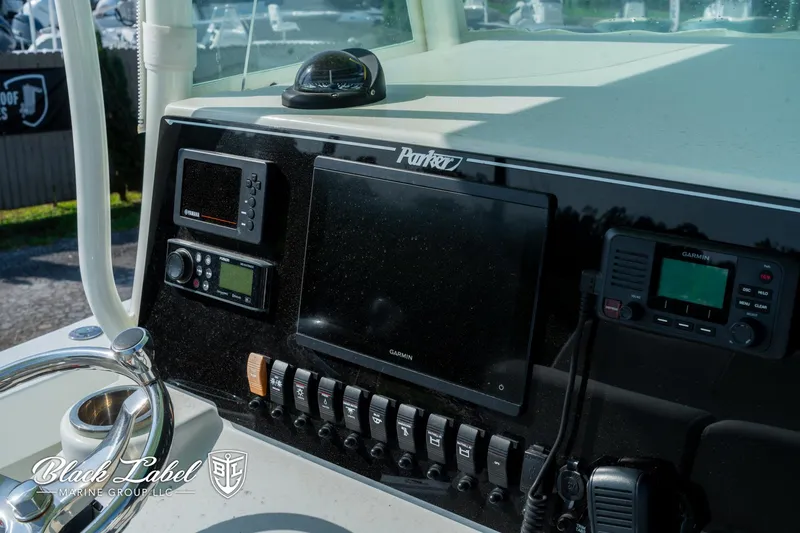 Slide: The Image of Dashboard of a 2020 Parker 2801cc boat with navigation and control systems. - 14