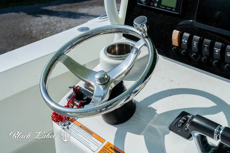 Slide: The Image of Steering wheel of a 2020 Parker 2801cc boat by Black Label Marine Group. - 17