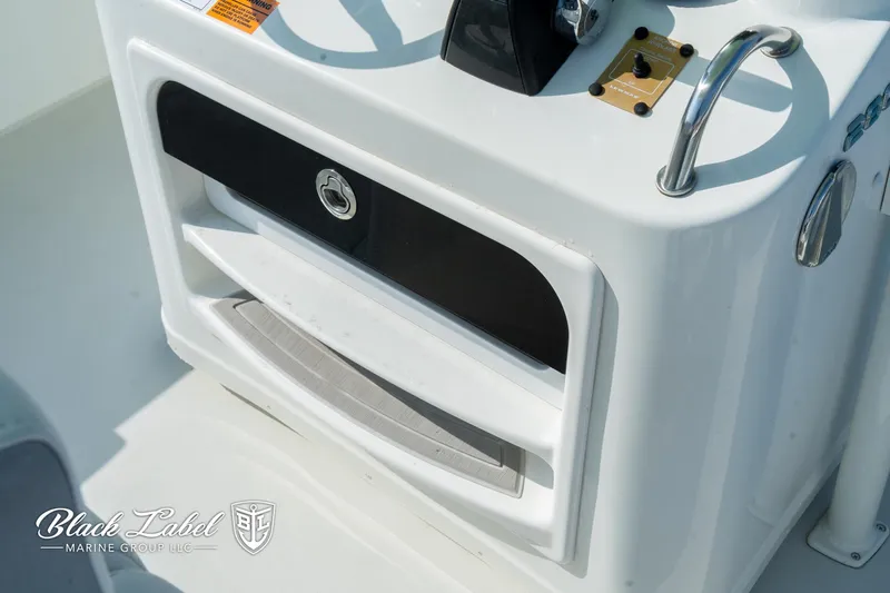 Slide: The Image of 2020 Parker 2801cc boat console with storage compartments and steering wheel. - 18
