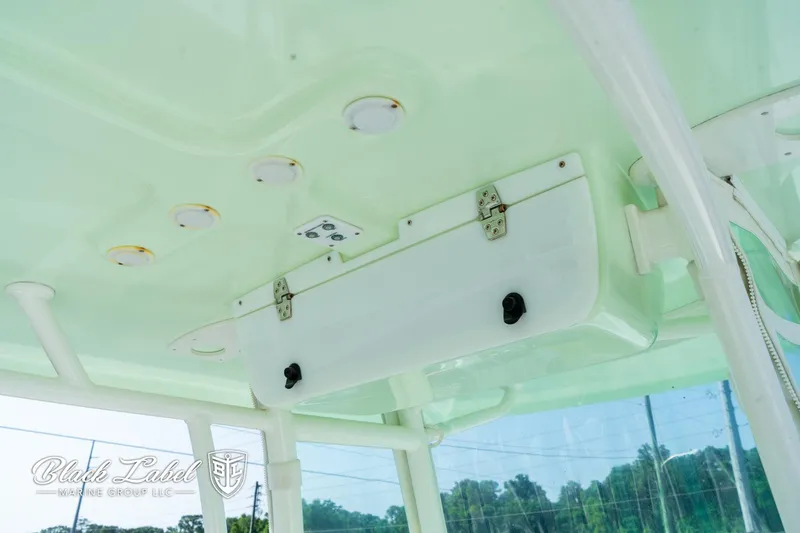 Slide: The Image of Parker 2801cc 2020 boat interior with storage compartment and lighting fixtures. - 21