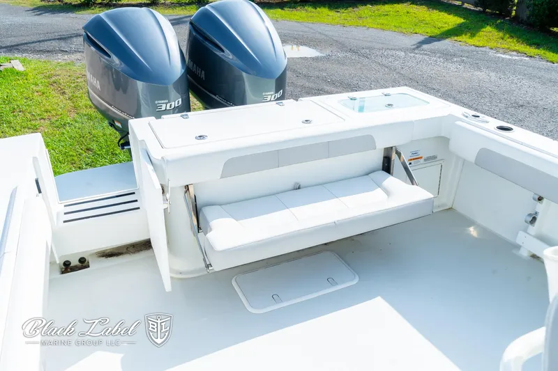 Slide: The Image of 2020 Parker 2801cc boat with twin Yamaha 300 engines, featuring a spacious deck. - 23