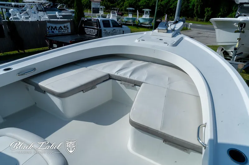 Slide: The Image of 2020 Parker 2801cc boat with cushioned seating, docked outdoors. - 26