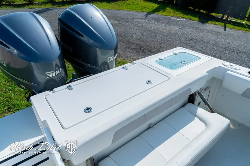 Slide: The Image of 2020 Parker 2801cc boat with dual Yamaha 300 engines, featuring a spacious deck. - 27