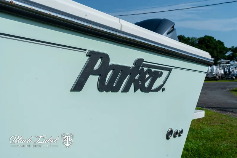 Slide: The Image of 2020 Parker 2801cc boat side view with logo, displayed outdoors. - 3
