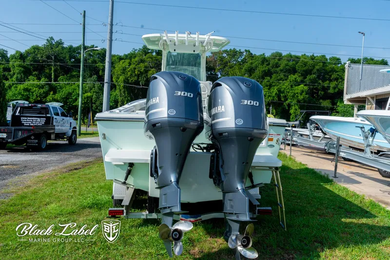Slide: The Image of 2020 Parker 2801cc boat with twin Yamaha 300 engines, displayed outdoors. - 4