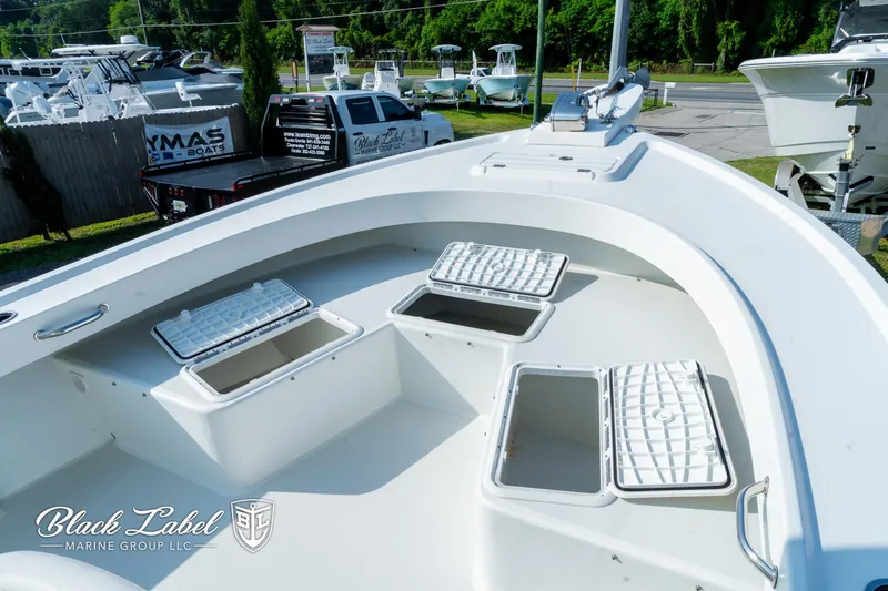 Slide: The Image of 2020 Parker 2801cc boat deck with open storage compartments, displayed at Black Label Marine Group. - 6