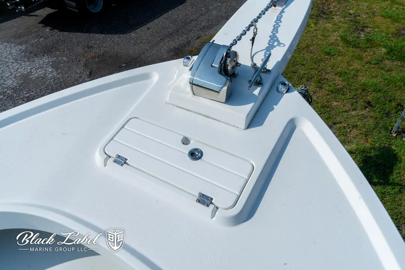 Slide: The Image of Bow of a 2020 Parker 2801cc boat with anchor chain and storage compartment. - 7