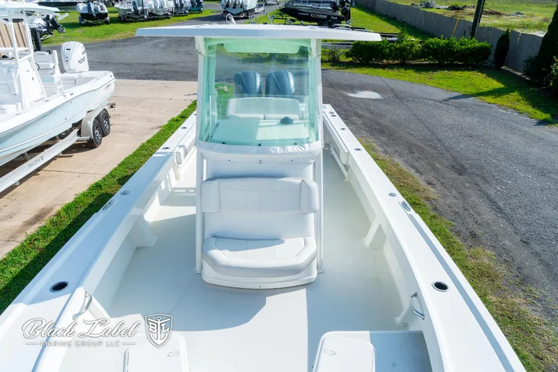 Slide: The Image of 2020 Parker 2801cc boat with center console and seating, displayed outdoors. - 9