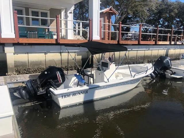 The Image of 2021 May-Craft 1800 Skiff boat named Tide Runner docked by a waterfront house. - 1