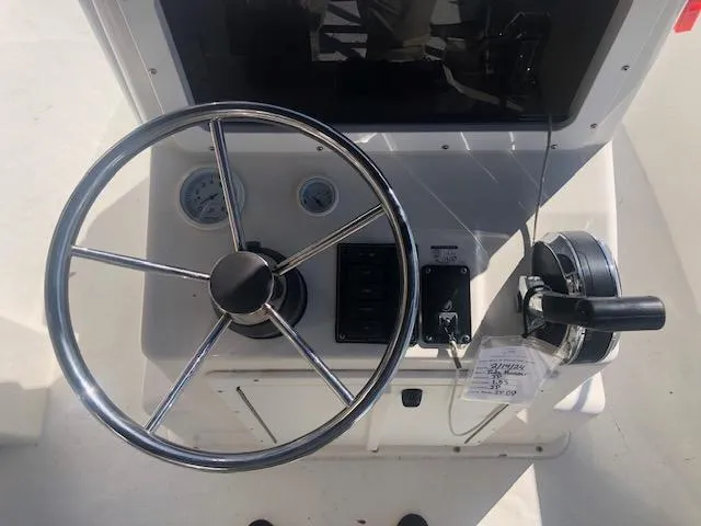 Slide: The Image of Steering console of a 2021 May-Craft 1800 Skiff boat. - 10