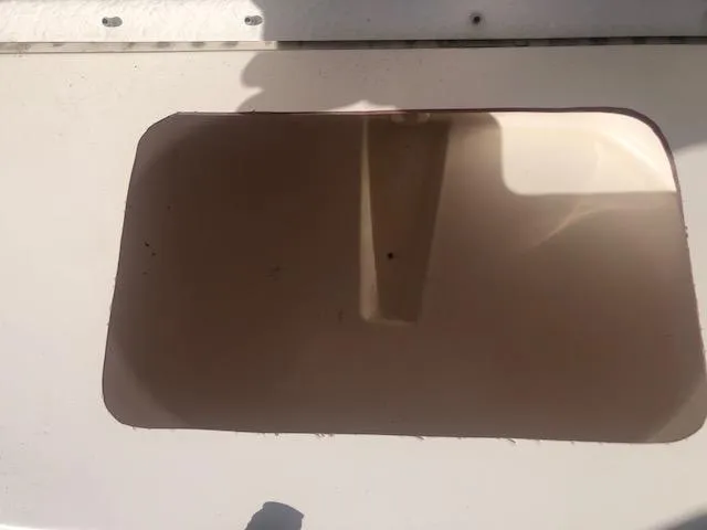 Slide: The Image of Open storage compartment on a 2021 May-Craft 1800 Skiff boat. - 14
