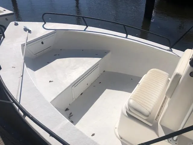 Slide: The Image of 2021 May-Craft 1800 Skiff boat interior with seating and storage compartments. - 5