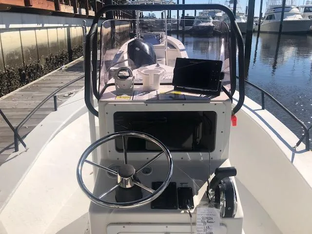 Slide: The Image of 2021 May-Craft 1800 Skiff boat console with steering wheel and navigation equipment. - 7