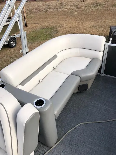 Slide: The Image of 2021 Sweetwater 2286 pontoon boat with white and gray seating. - 11