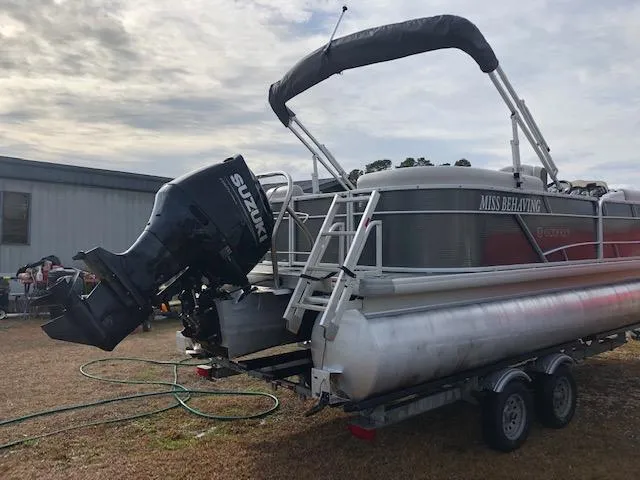 Slide: The Image of 2021 Sweetwater 2286 pontoon boat on trailer with Suzuki outboard motor. - 3