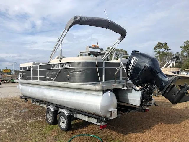 Slide: The Image of 2021 Sweetwater 2286 pontoon boat on trailer with Suzuki outboard motor. - 4