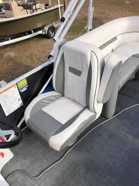 Slide: The Image of 2021 Sweetwater 2286 boat interior with gray and white seating. - 8