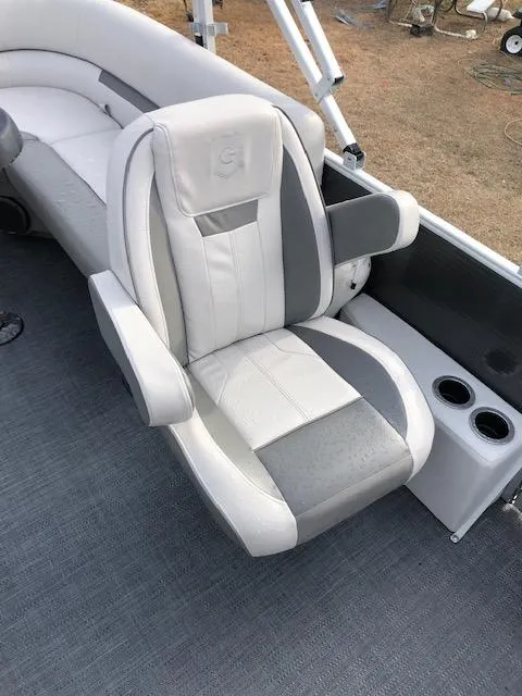 Slide: The Image of 2021 Sweetwater 2286 boat with comfortable captain's chair and cup holders. - 9