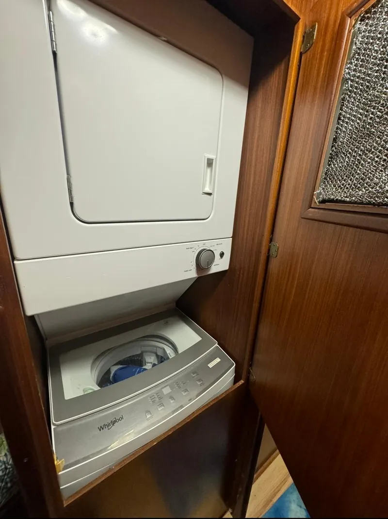 Slide: The Image of Stacked washer and dryer in 1990 Hatteras 45 Convertible yacht. - 17