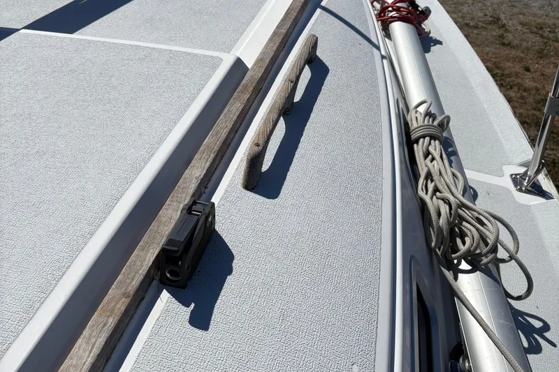 Slide: The Image of Deck of a 2002 Precision 23 sailboat with rigging and cleat. - 10