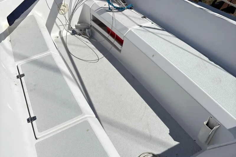 Slide: The Image of Cockpit of a 2002 Precision 23 sailboat, featuring clean seating and rigging. - 11