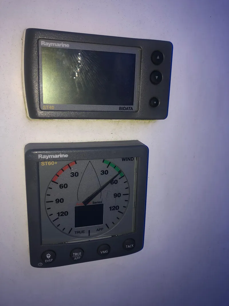 Slide: The Image of Raymarine marine instruments on Precision 23, 2002 model, displaying navigation data. - 4
