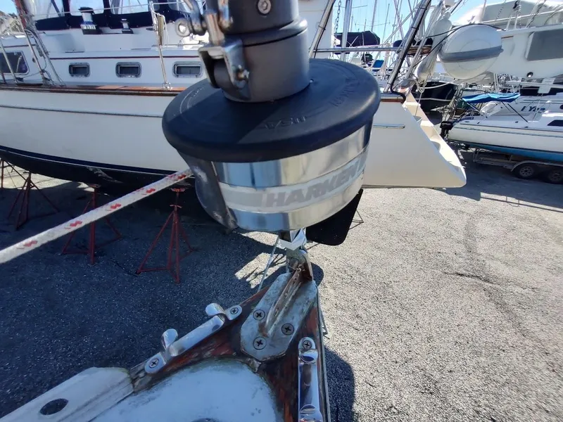 Slide: The Image of Close-up of a 1979 Endeavour 32 sailboat's deck hardware and furling system in a boatyard. - 16