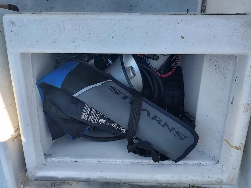 Slide: The Image of Storage compartment on a 1979 Endeavour 32 sailboat with life jacket and equipment. - 31