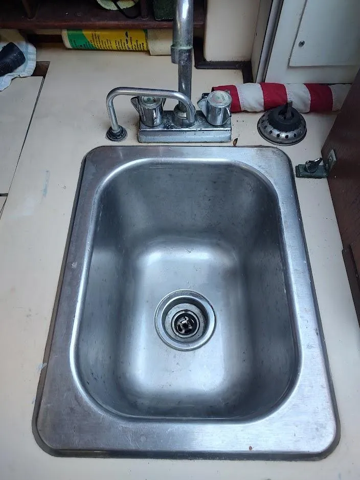 Slide: The Image of Stainless steel sink in a 1979 Endeavour 32 boat kitchen. - 42