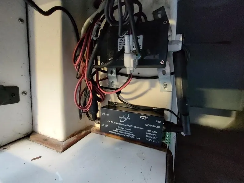 Slide: The Image of Electrical wiring and GPS receiver setup inside a 1979 Endeavour 32 boat. - 49