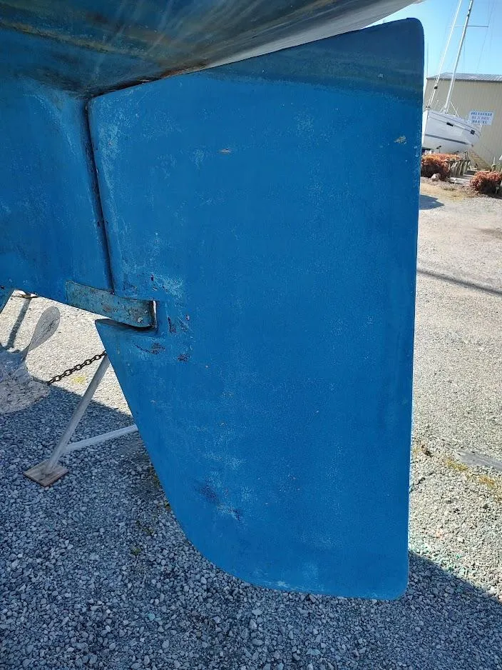 Slide: The Image of Close-up of a blue rudder on a 1979 Endeavour 32 sailboat. - 8