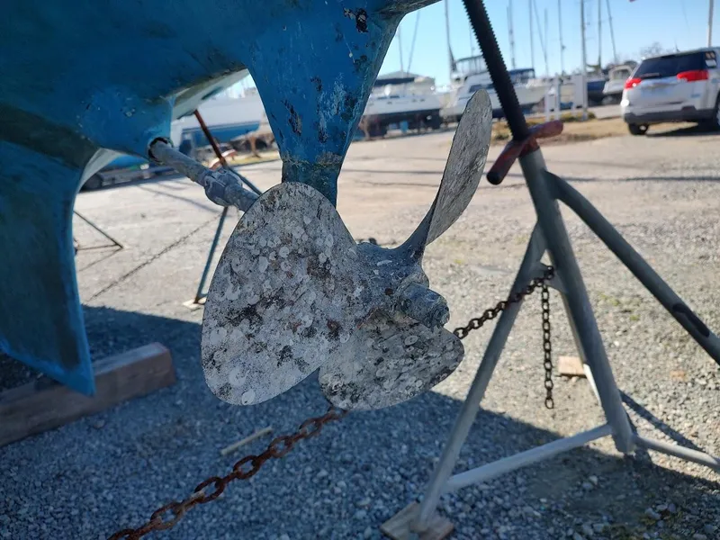 Slide: The Image of Close-up of a weathered propeller on a 1979 Endeavour 32 sailboat in a boatyard. - 9