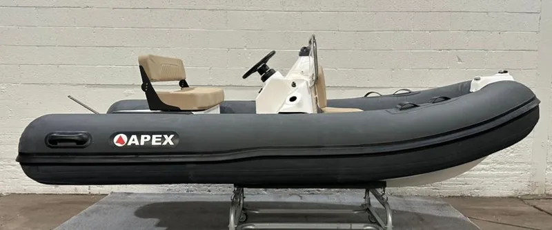 Slide: The Image of 2024 Apex A-12 Deluxe Tender inflatable boat with steering console and seating. - 4