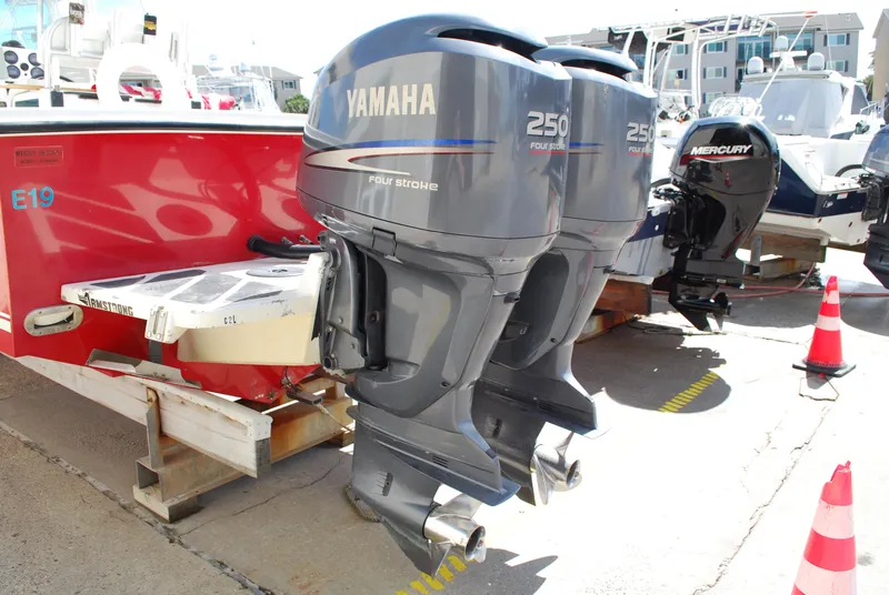 Slide: The Image of 1996 Regulator 26 Classic boat with twin Yamaha 250 outboard engines. - 12