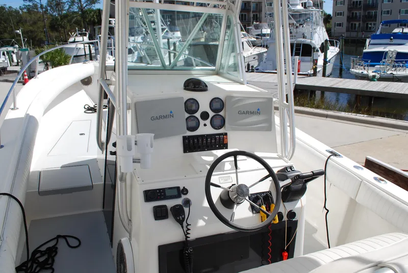 Slide: The Image of 1996 Regulator 26 Classic boat cockpit with Garmin navigation system. - 22