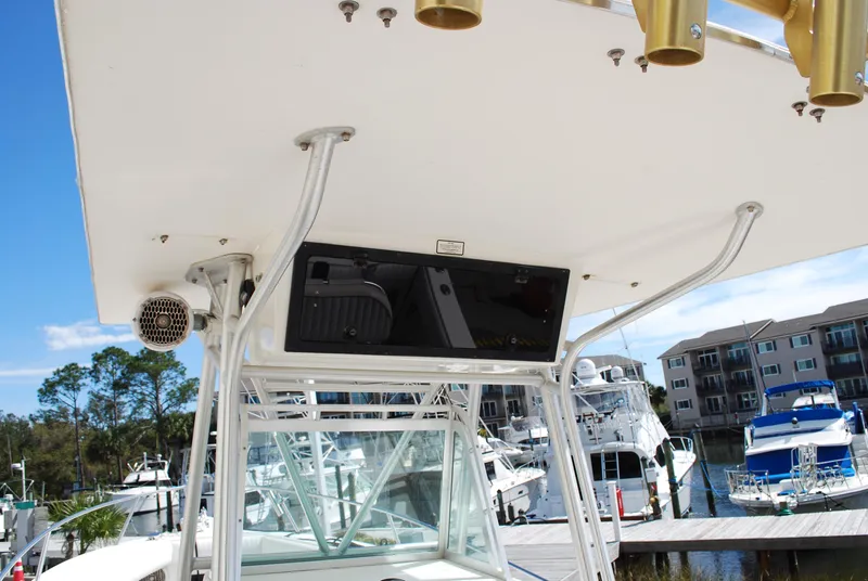 Slide: The Image of 1996 Regulator 26 Classic boat at marina with clear blue sky. - 23