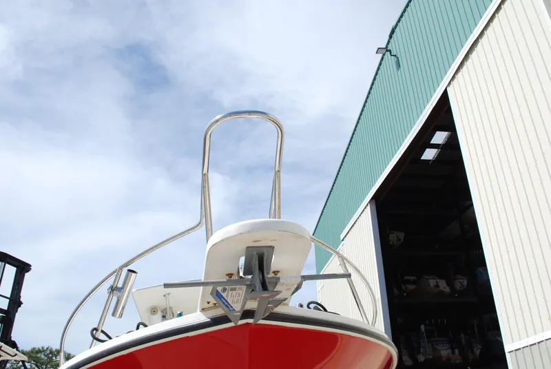 Slide: The Image of 1996 Regulator 26 Classic boat in front of a large storage building. - 3