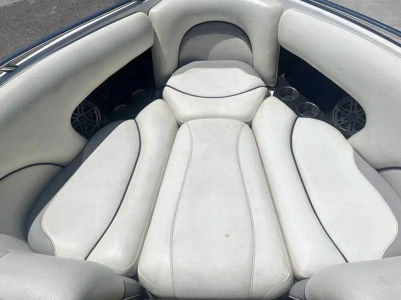 Slide: The Image of 2007 Malibu 247 LSV boat interior seating with white upholstery. - 13