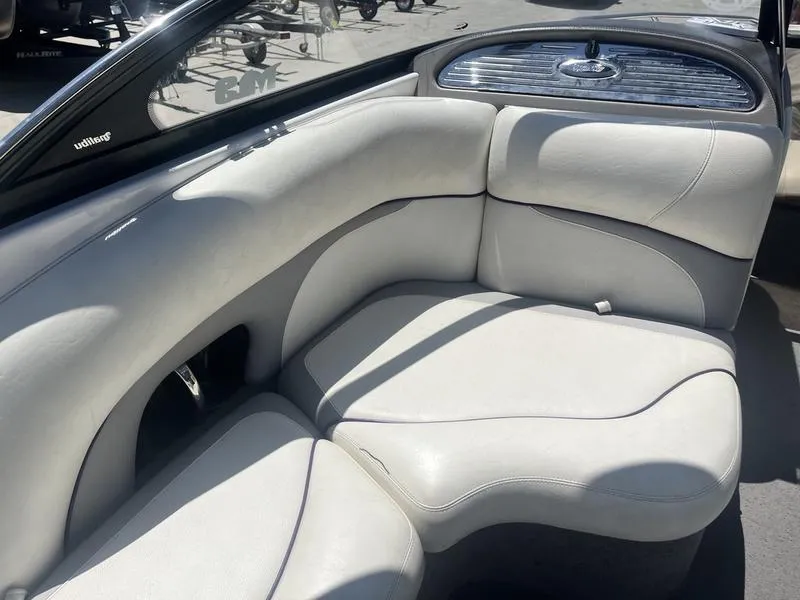 Slide: The Image of 2007 Malibu 247 LSV boat interior with white leather seating. - 15